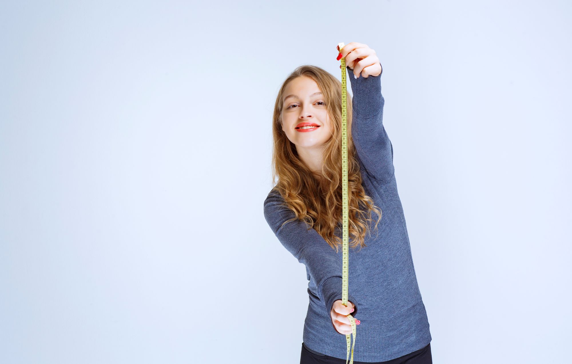 Teenage girl with measuring tape: How to increase height naturally after 18? How to activate pituitary gland to increase height naturally?