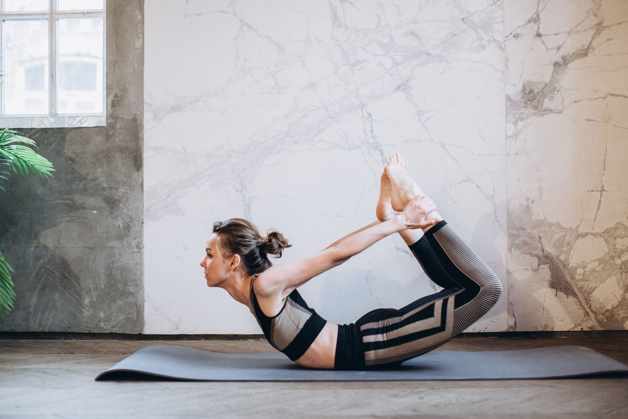 Bow pose yoga to regulate irregular periods
