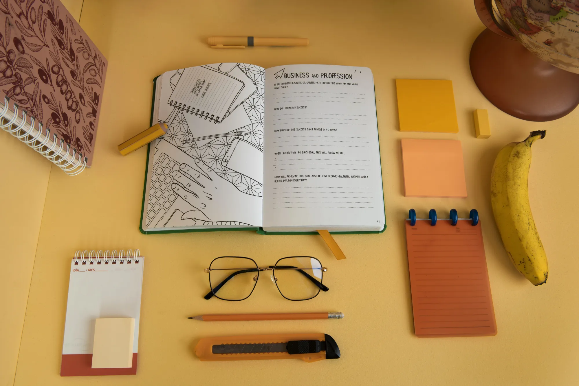 Different types of paper journals, with different textures, size and colours kept on a table