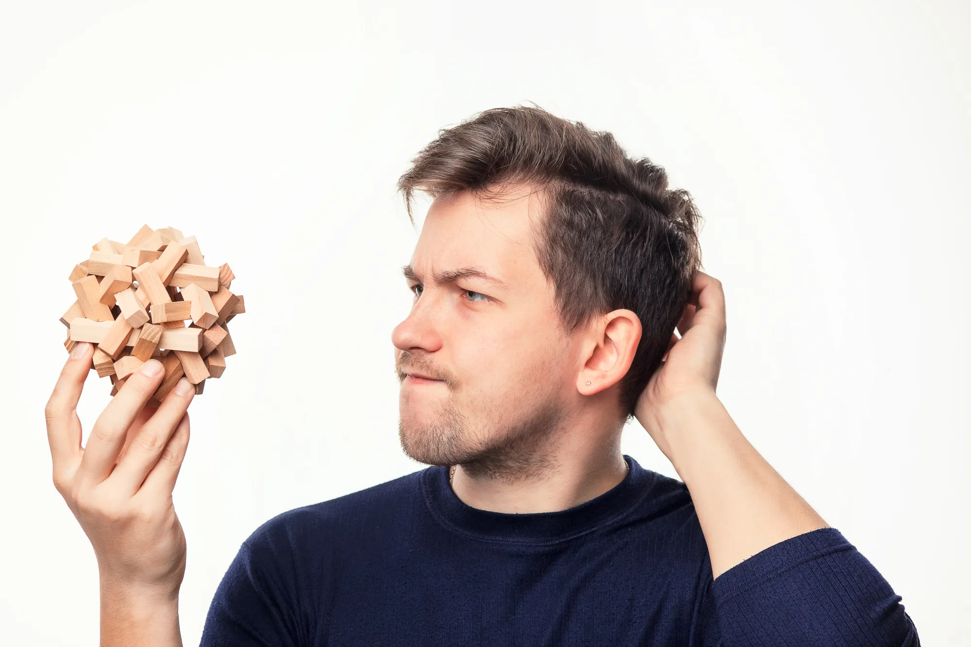 A man holding a puzzle as a part of a mental exercise to improve memory