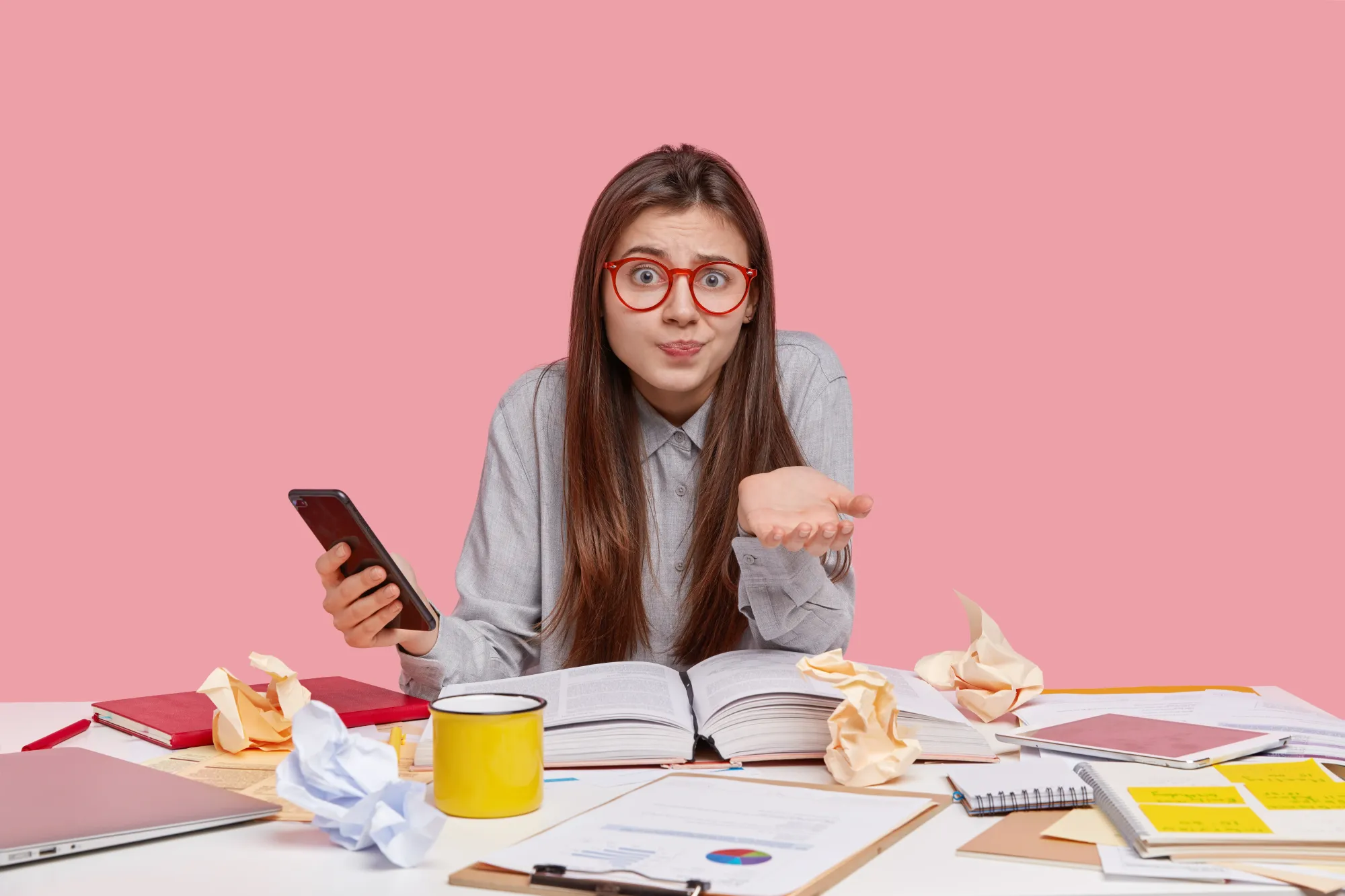 Which time is best for study? (Hesitant clueless young woman holding phone in hand)