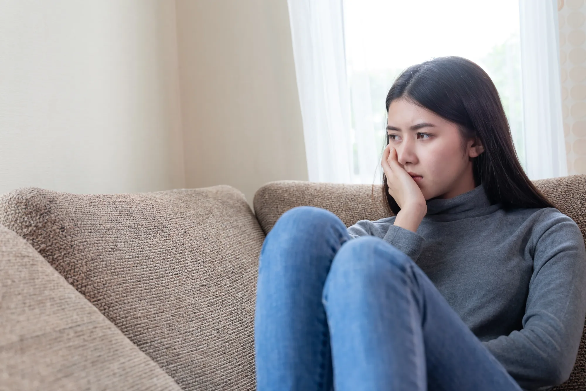 A girl student sitting in stress having of the 10 negative thoughts