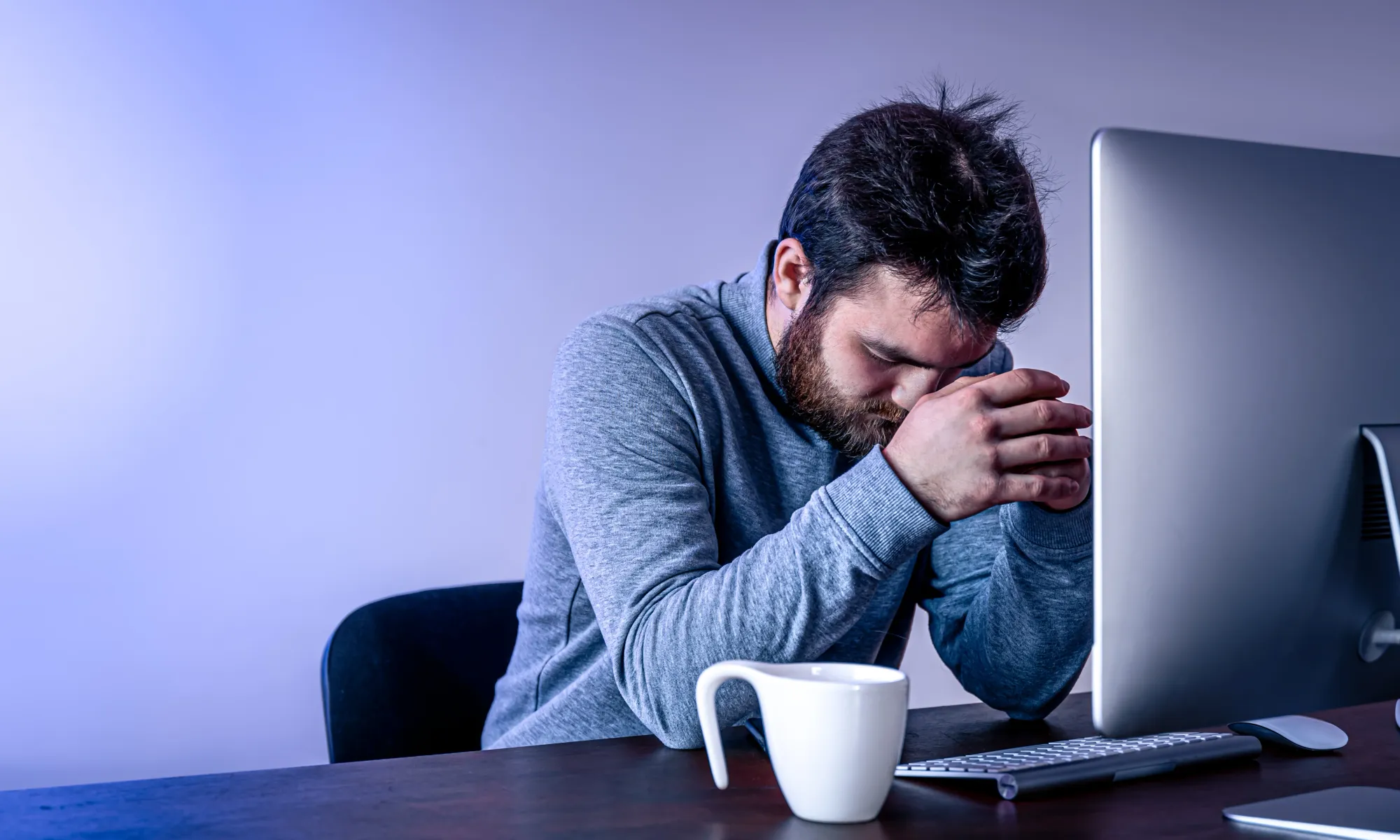 A tired man sitting in front of the computer, 'I need a break from my brain'
