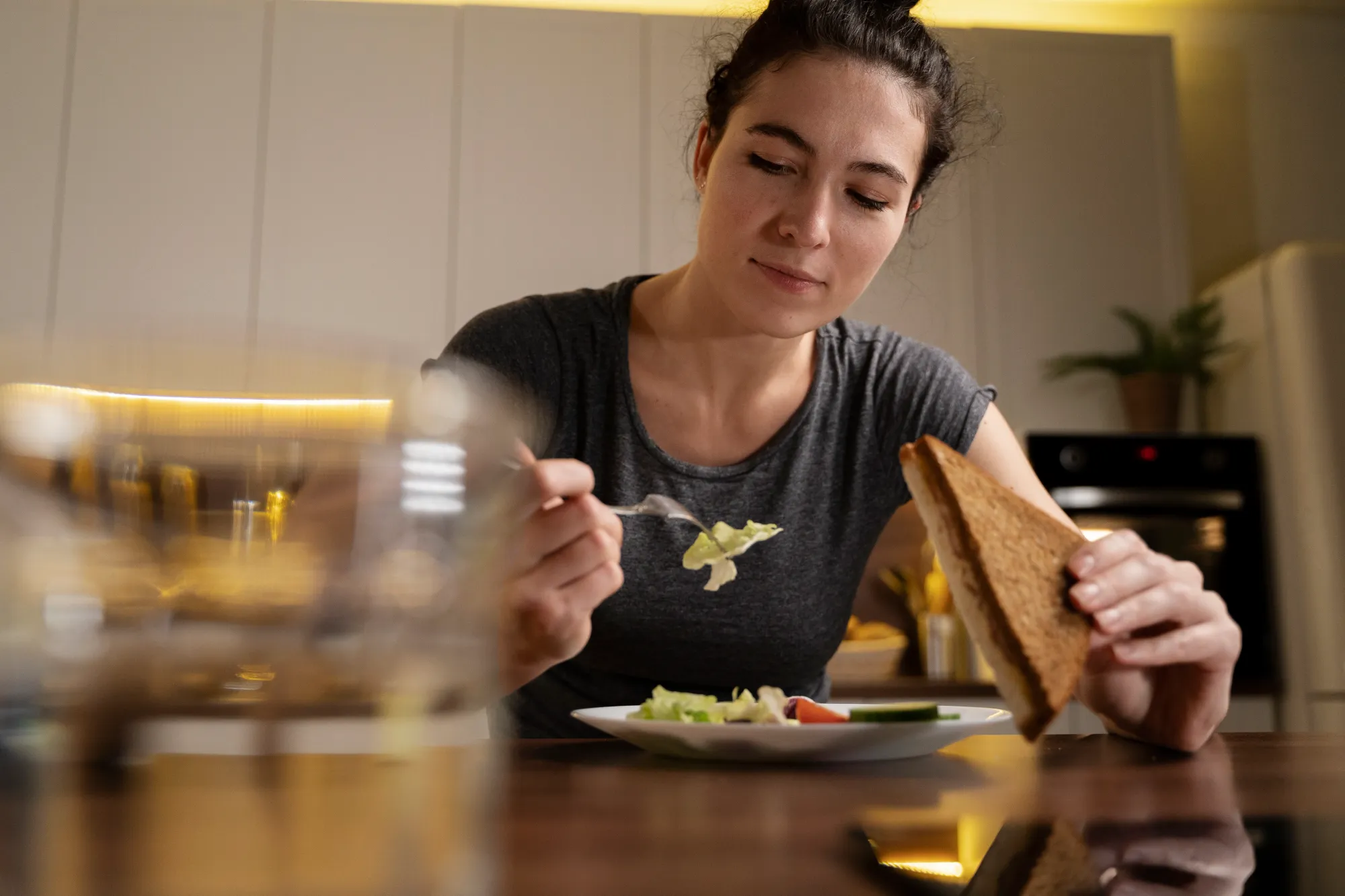 Tip of the day: A woman eating mindfully to eat better for good food, good life
