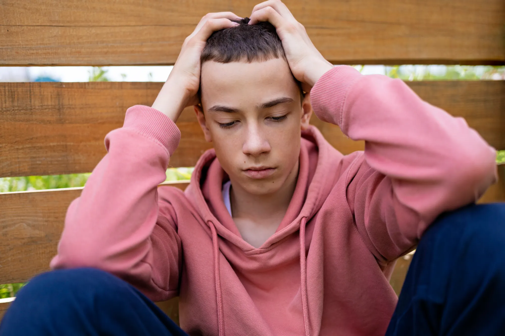 A student, frustrated, having different thoughts which bring in negativity