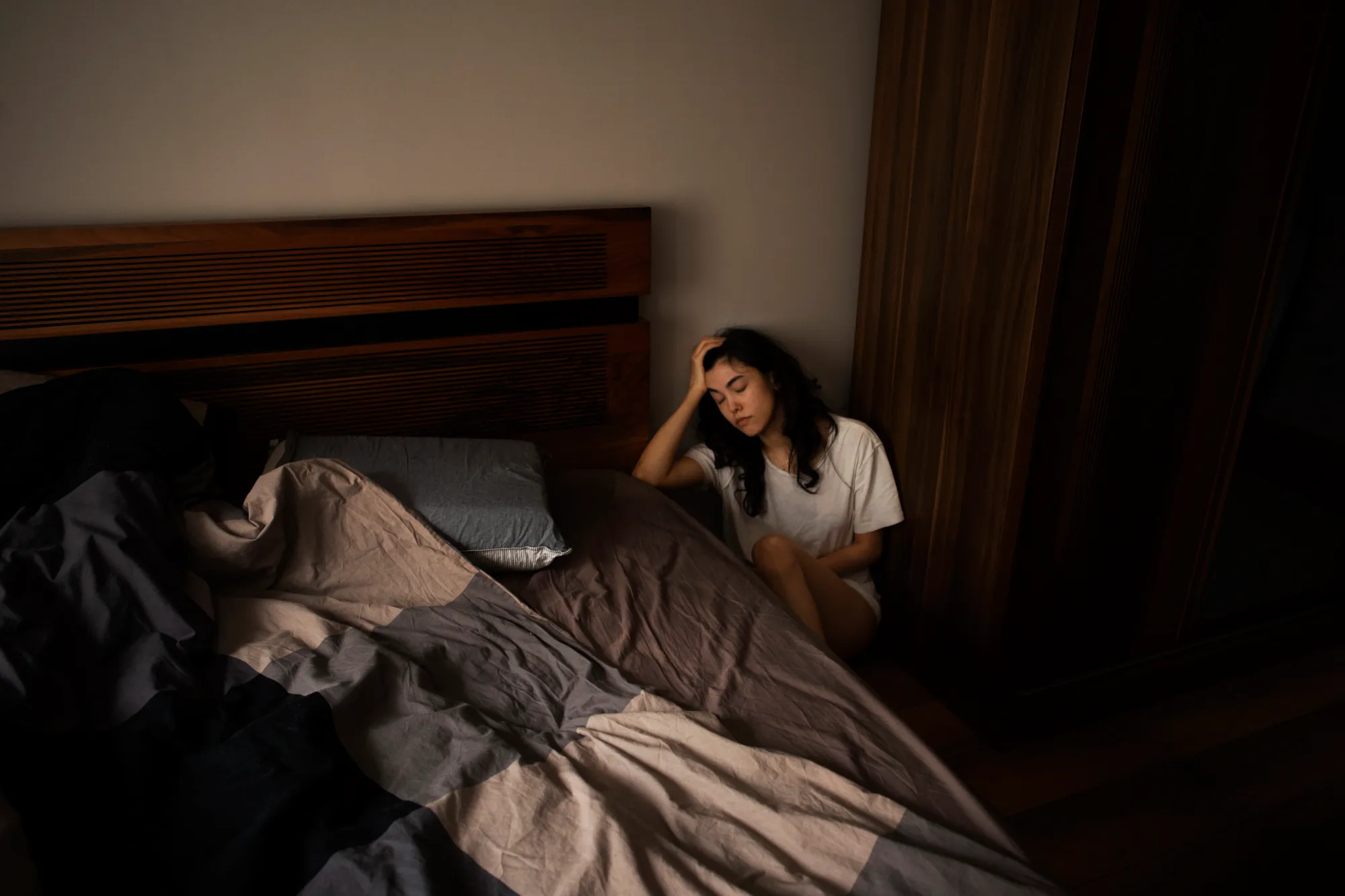 A woman thinking, "Do not use mobile before sleep as it makes you feel tired."