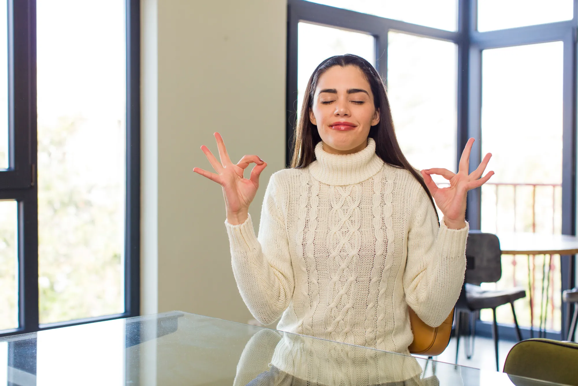 A woman doing a one minute meditation to stabilize thoughts and feelings