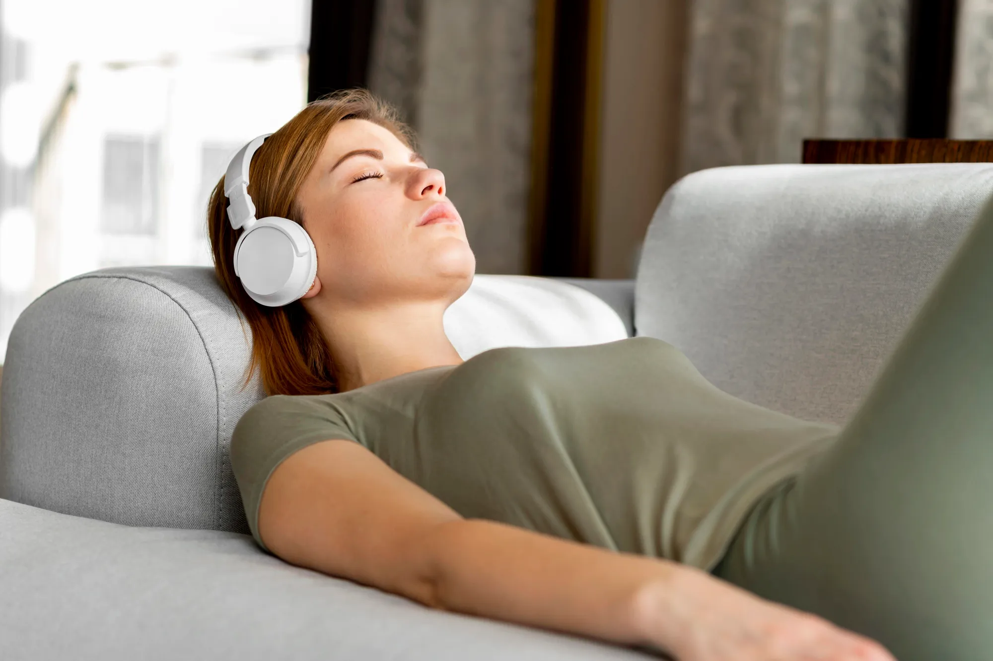 A woman, listening to sleep music, sleeping peacefully