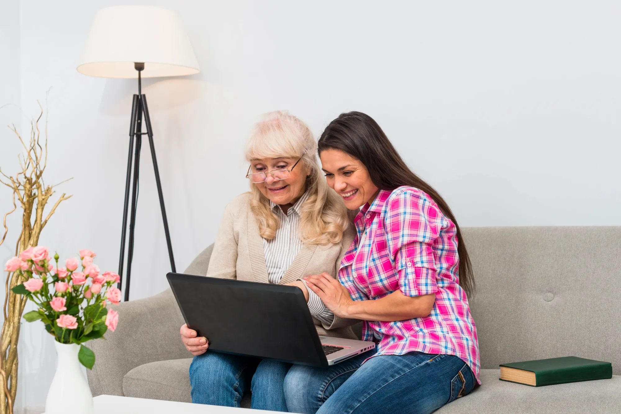 A daughter helping her mother with tech on mother's day