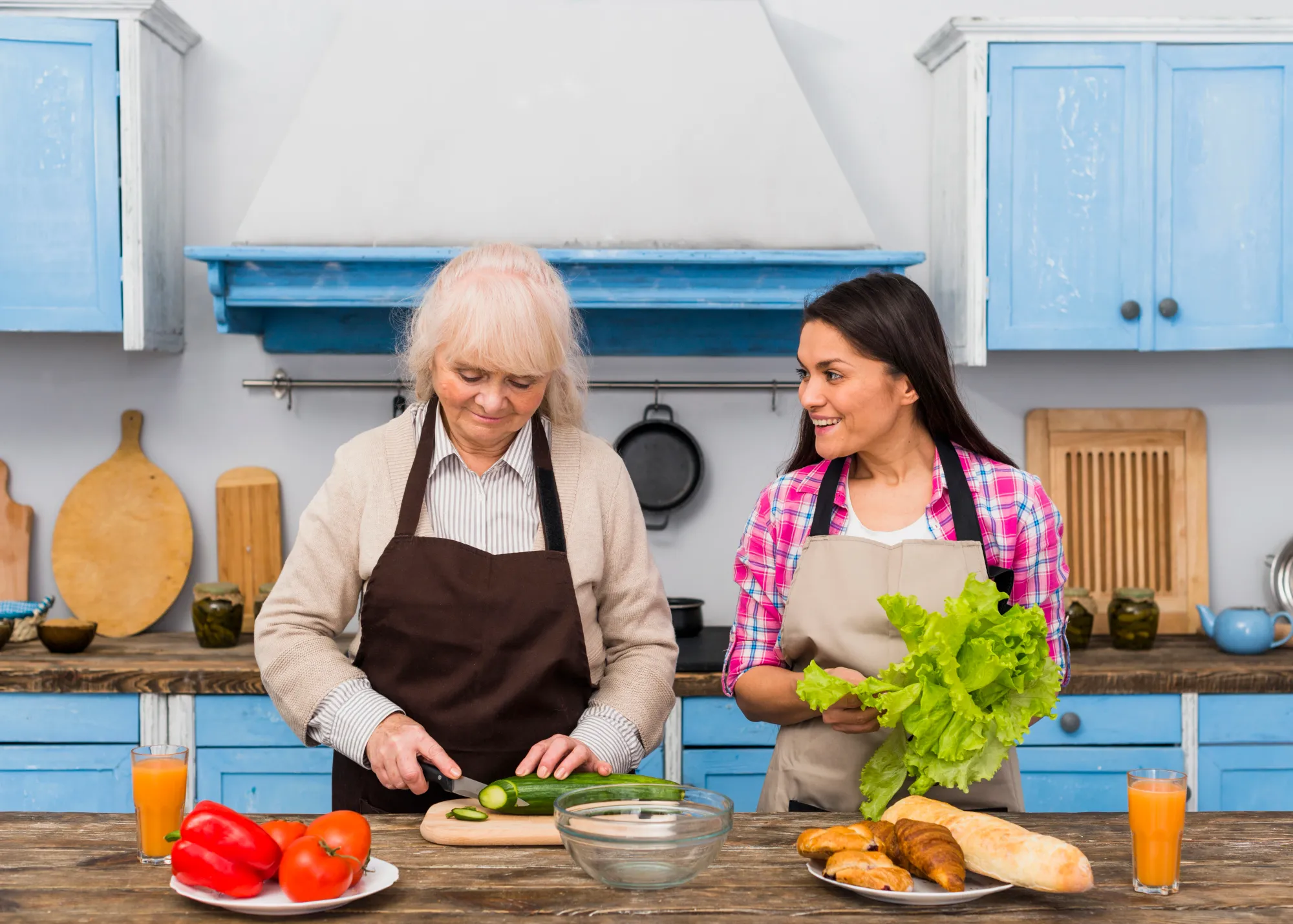 A daughter cooking together with her mother saying, "My mom is the best"