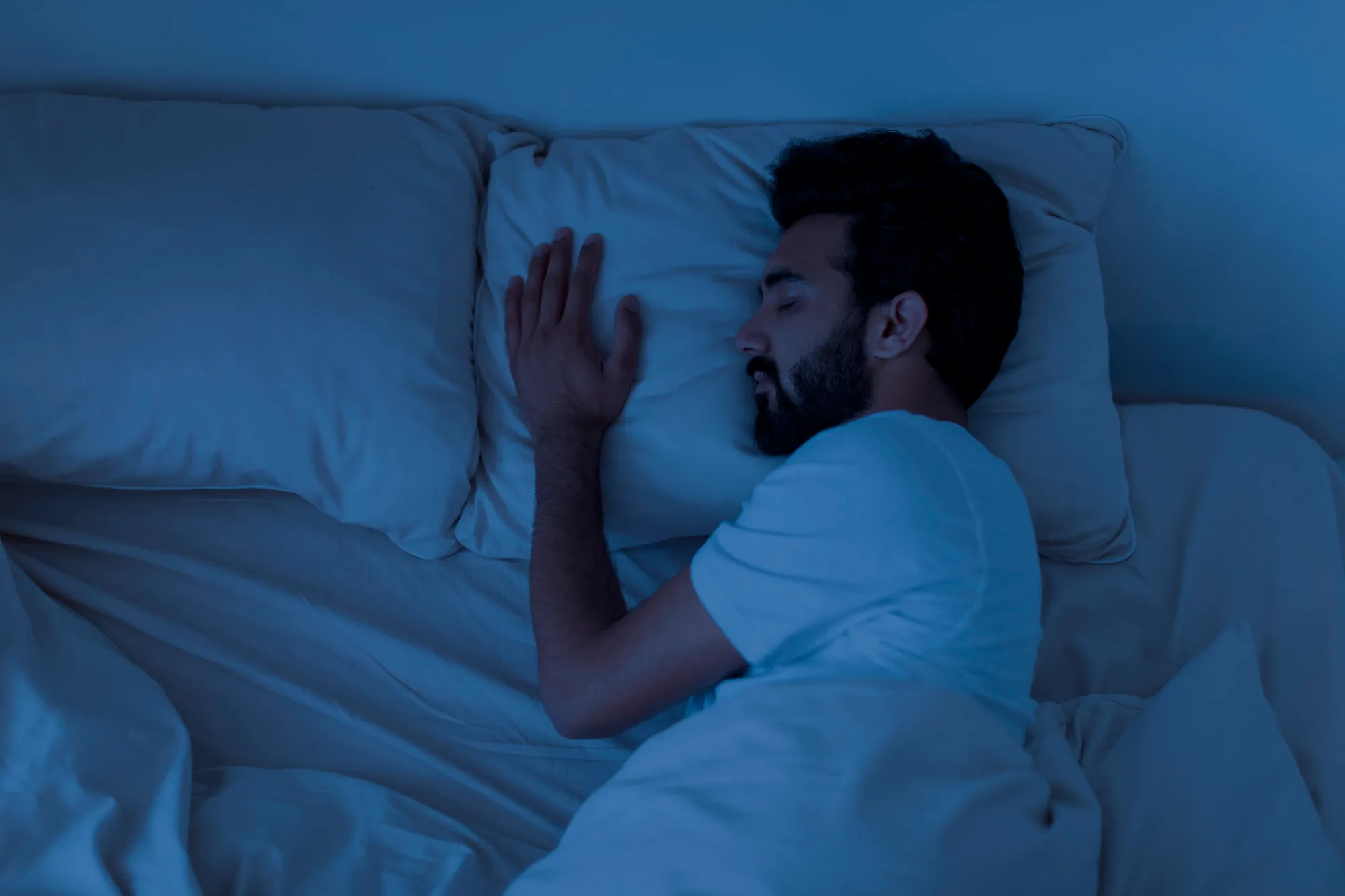 A man relaxing at night with mind relaxing music