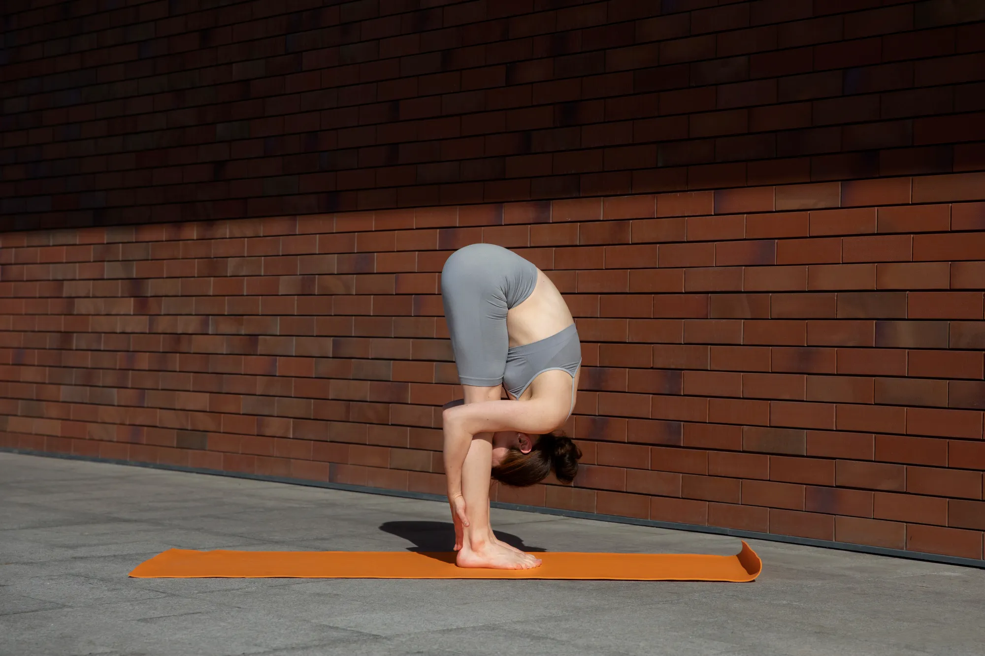 A woman doing Surya Namaskar for the body and mind