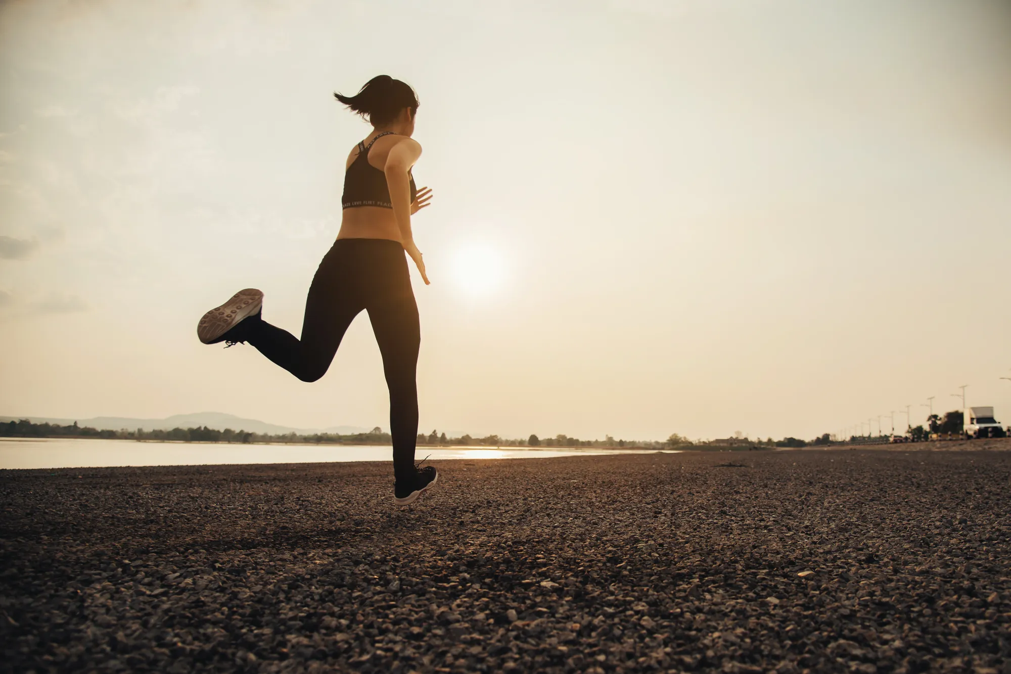 A woman running to deal with a breakup in a healthy manner