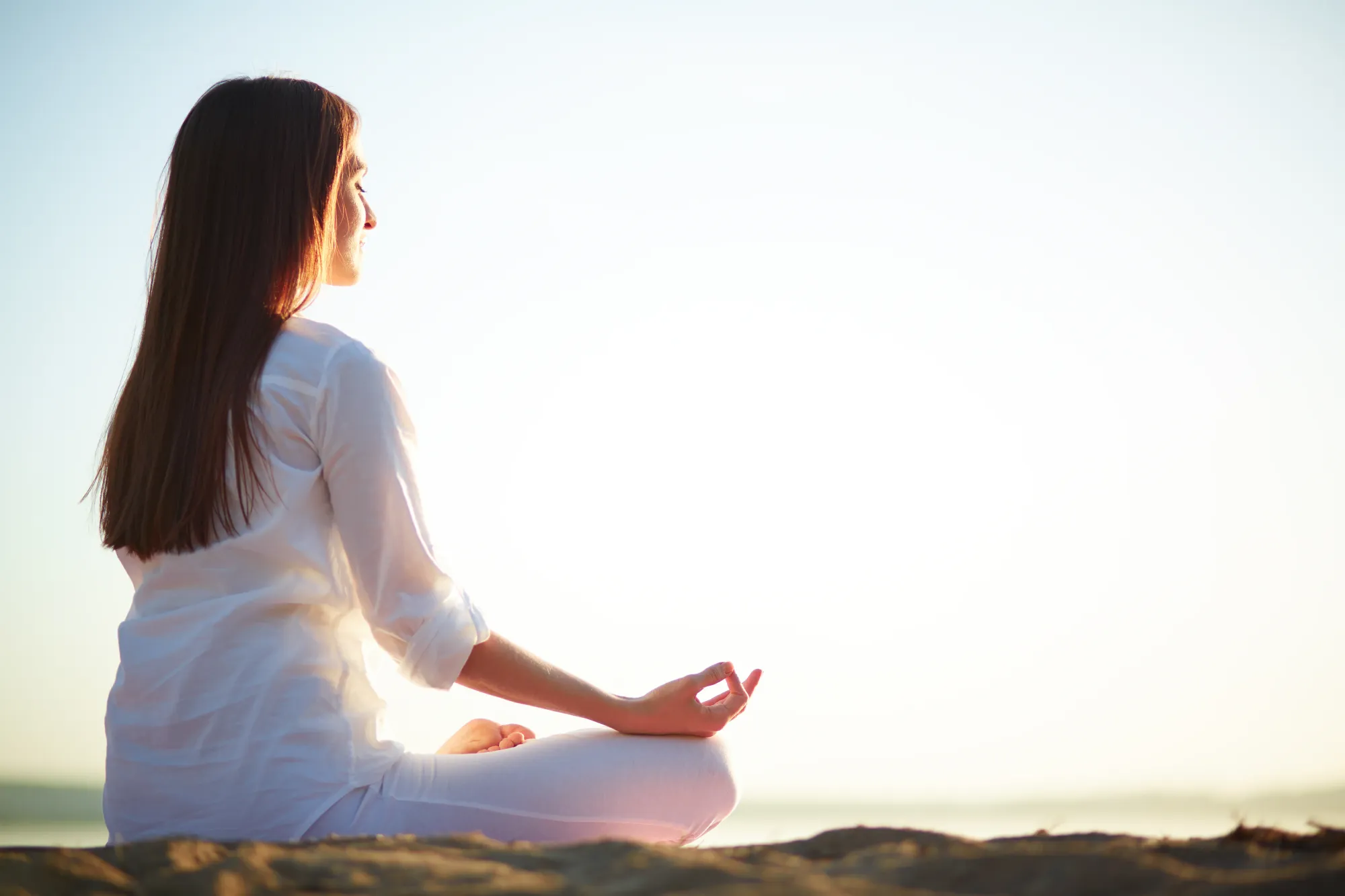 A woman chanting Shree Kala Bhairava mantra lyrics for inner peace and stability