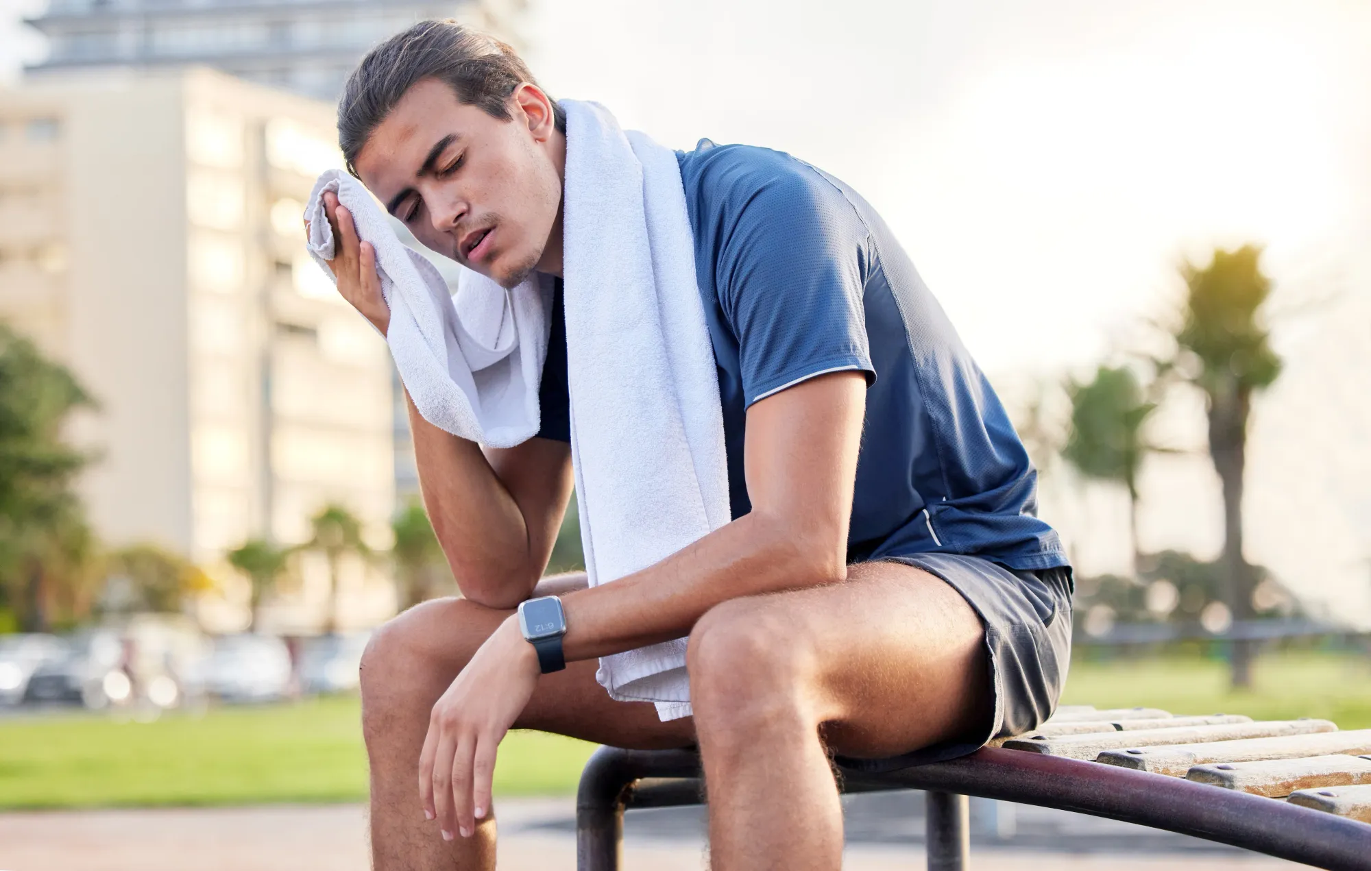 A tired man thinki g what to do and eat after workout