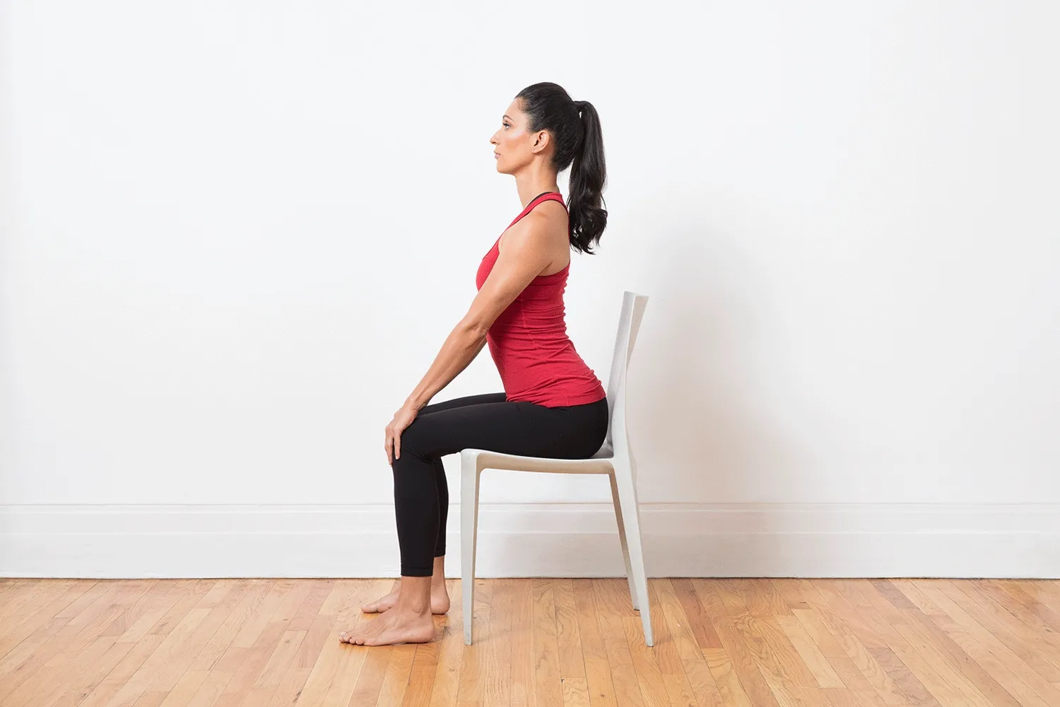 A woman doing sitting yoga poses at work