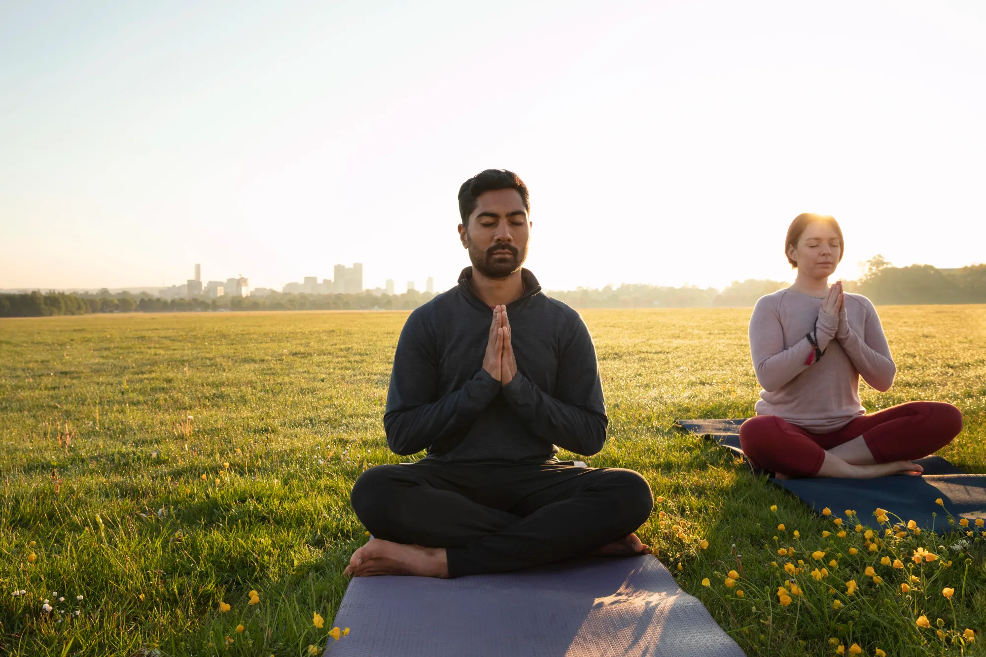 Person meditating as part of their new year resolution for good health habits.