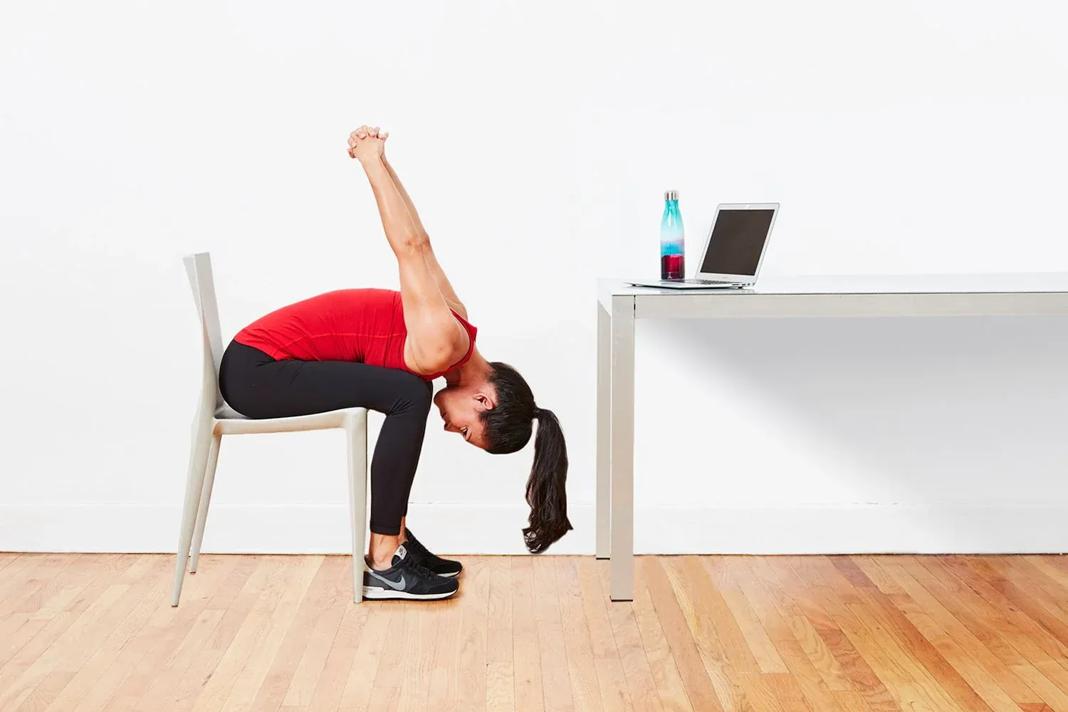 Seated forward bend, a sitting asana, relieves lower back stress