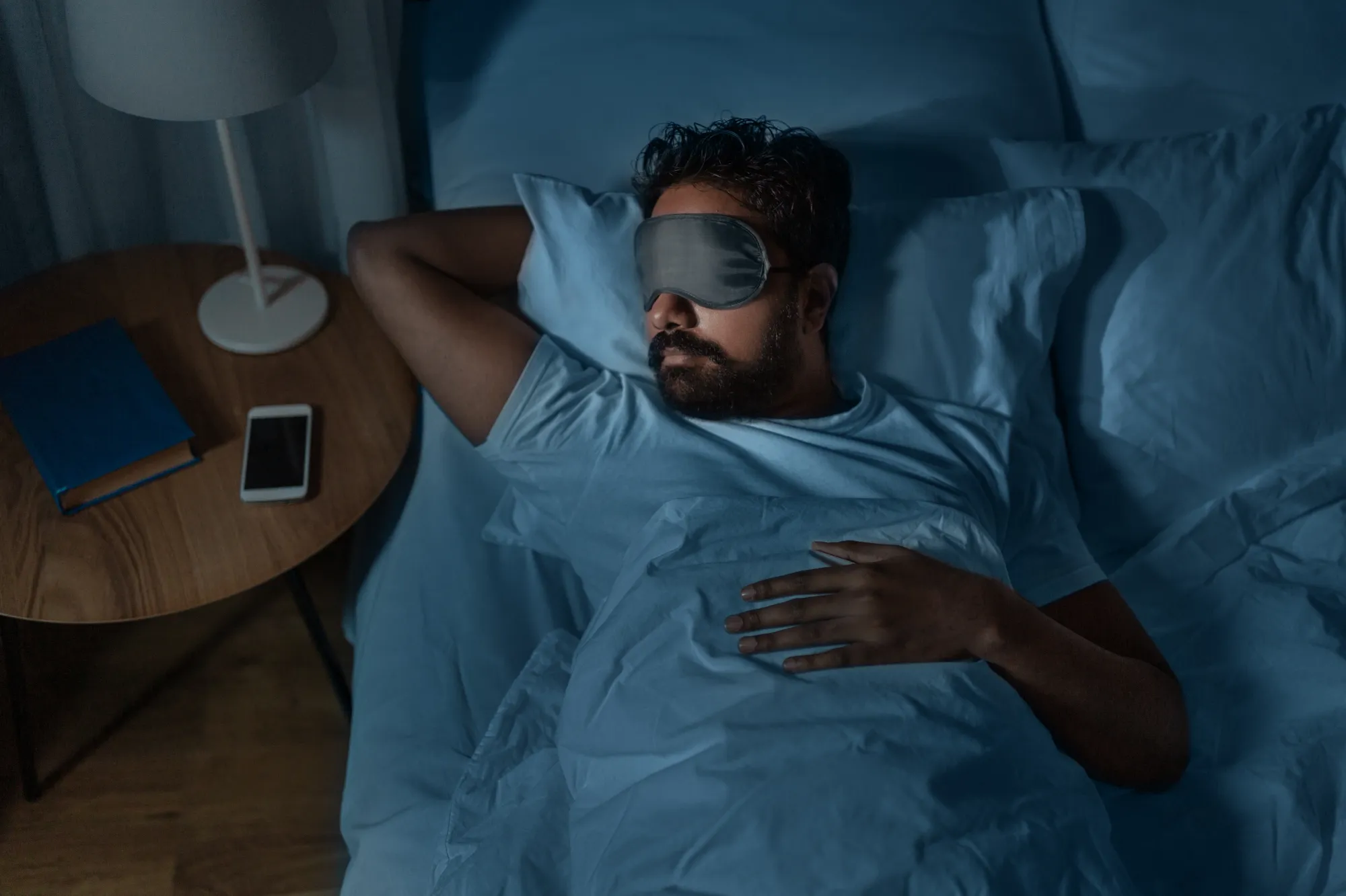 A man sleeping at night isntead of taking an afternoon nap